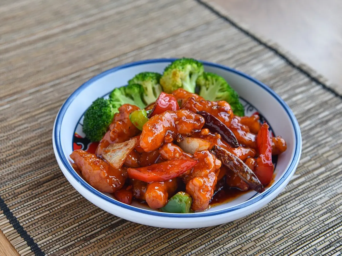 Pacifc-Asian-Cuisine-Chinese-restaurant-General-Tso’s-Chicken-RI General Tso's Chicken features bite - sized chicken pieces stir - fried with peppers, onions, and dried chilies in a savory - sweet sauce