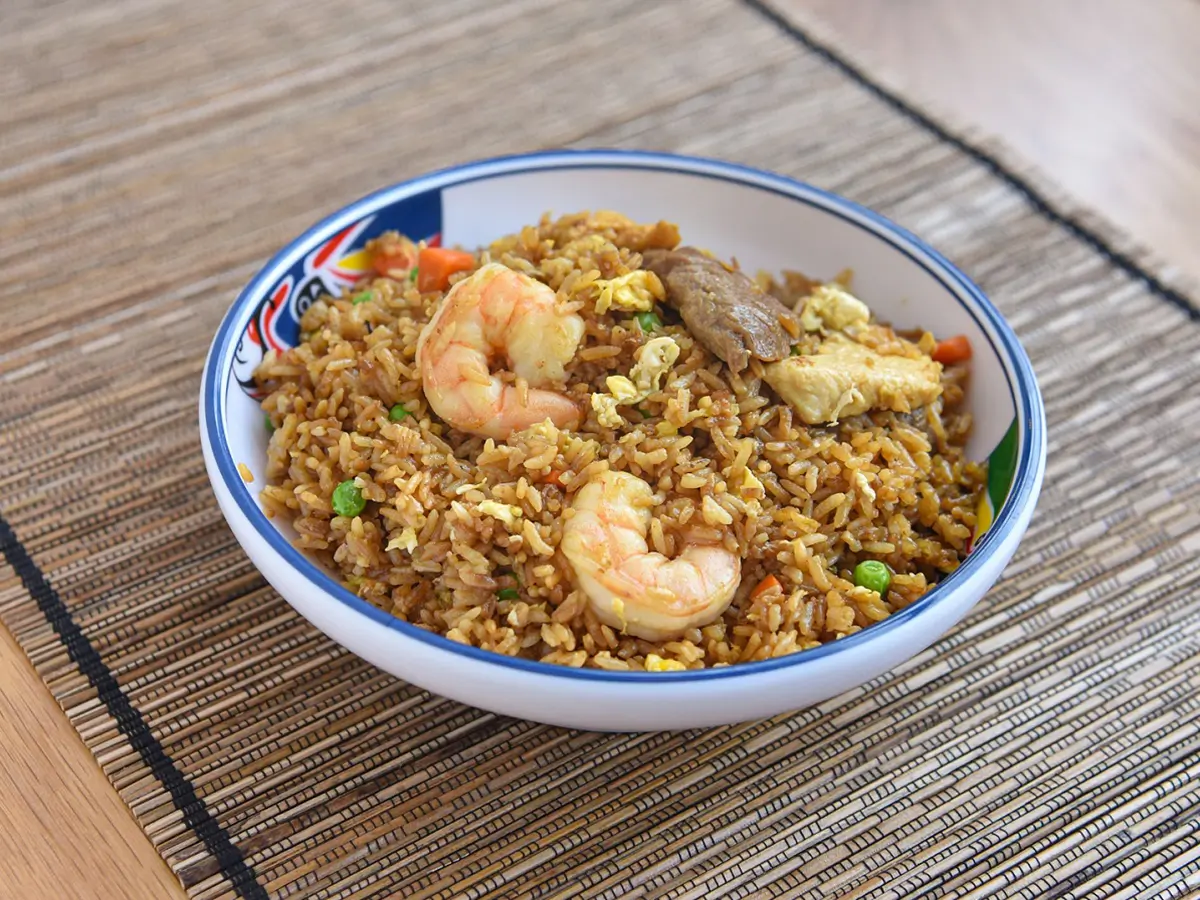 Seafood and Mixed Meat Fried Rice combined with succulent shrimp, pieces of meat, scrambled eggs, peas, and carrots